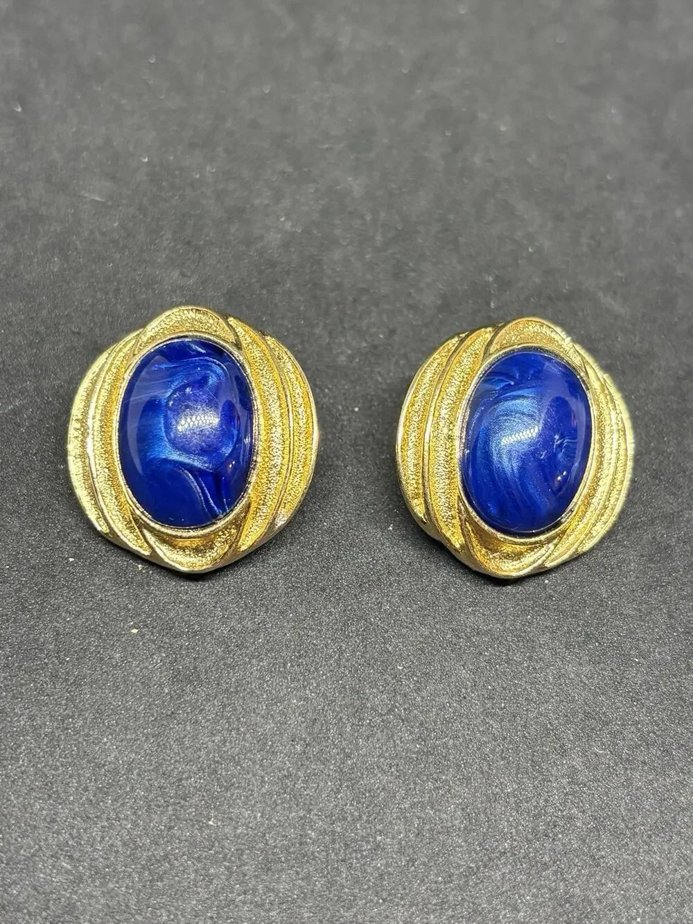Vintage Trifari Gold Tone Blue Faux Lapis Cabochon Clip Earrings Brushed Swirl